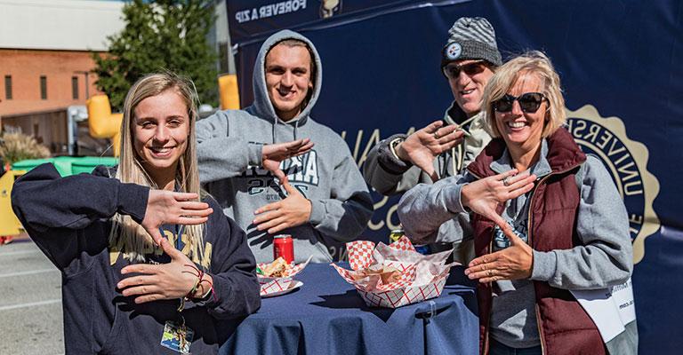 Image of adult non-traditional student meeting with professor at the University of Akron